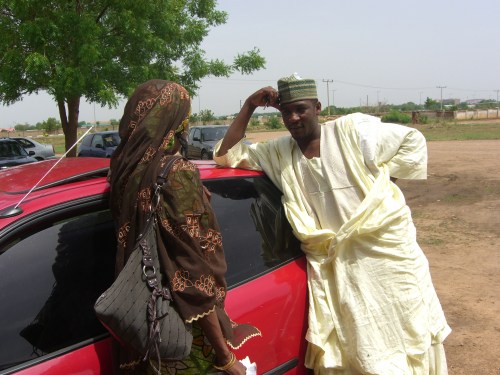 Singer Aminu Ala speaking with friend, novelist Sa'adatu Baba Fagge, before his court case on 7 July 2009, Airport Magistrate Court, Kano.