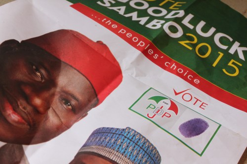 PDP poster shoved through bus windows, 25 March 2014. (c) Carmen McCain